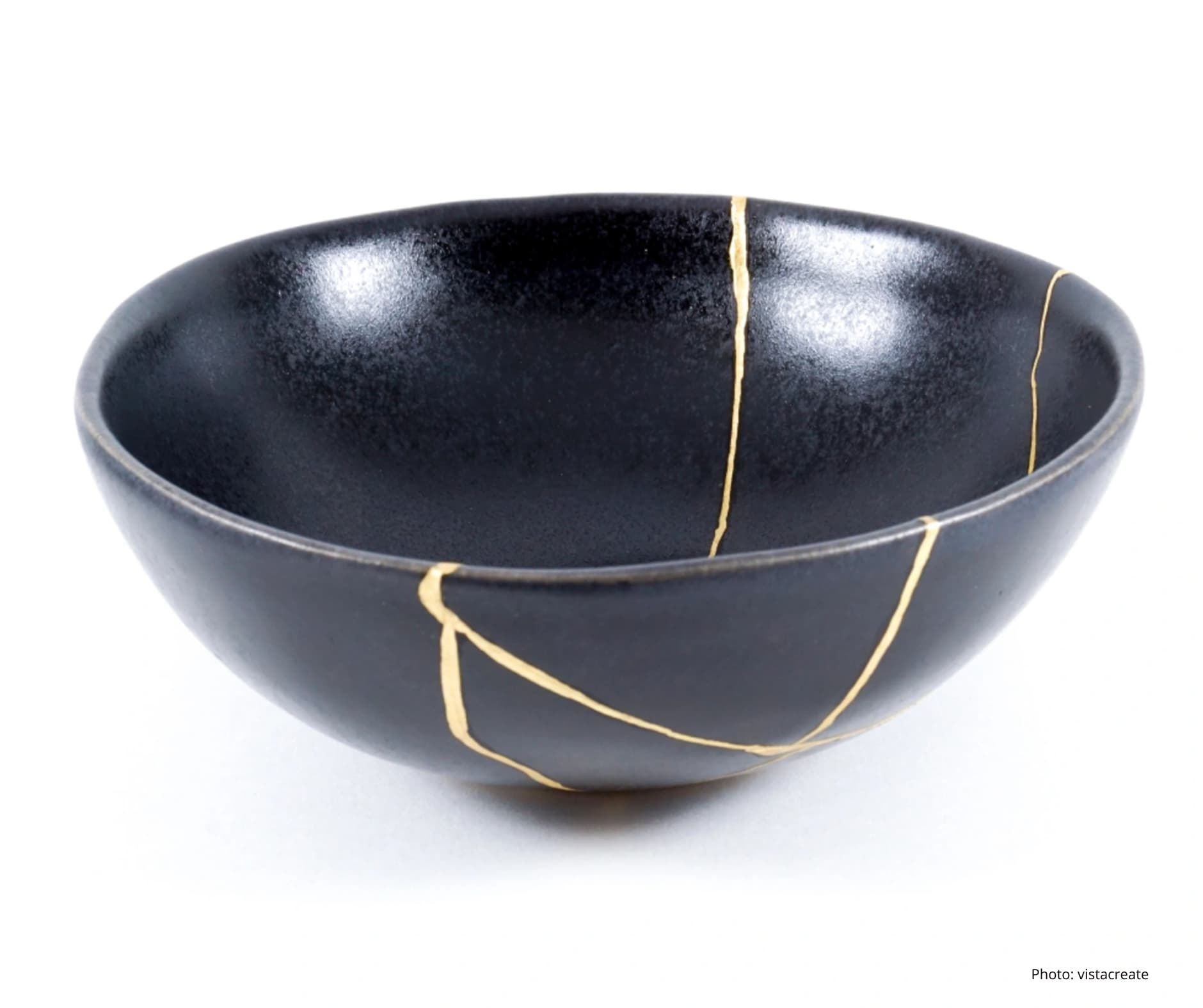 Kintsugi pottery powerful radical acceptance A beautifully repaired ceramic bowl, following the Japanese art of Kintsugi. Cracks are filled with shining gold lacquer, highlighting the breaks as a beautiful part of the object's history.