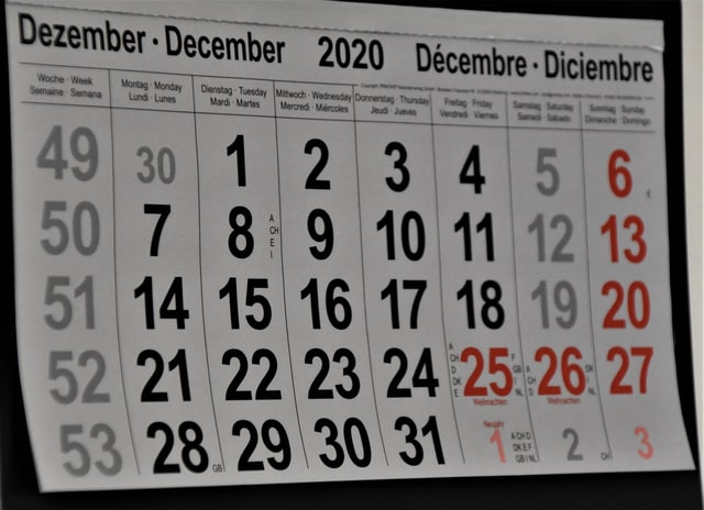 paper wall calendar showing month of December 2020